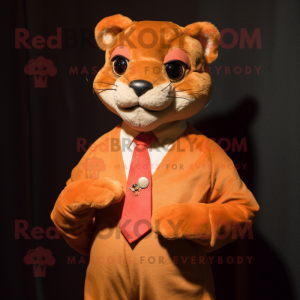 Orange Jaguarundi mascot costume character dressed with a Romper and Tie pins