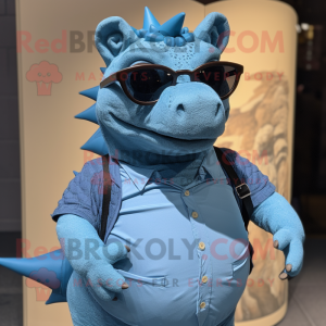 Blue Ankylosaurus mascot costume character dressed with a Henley Shirt and Eyeglasses