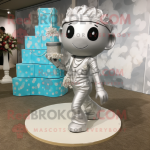 Silver Wedding Cake mascot costume character dressed with a Romper and Tote bags