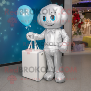 Silver Wedding Cake mascot costume character dressed with a Romper and Tote bags
