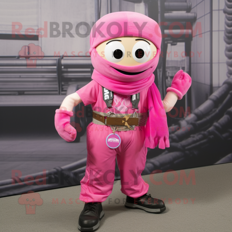 Pink Bracelet mascot costume character dressed with a Cargo Pants and Scarf clips Pink Bracelet mascot costume character dressed with a Cargo Pants and Scarf clips