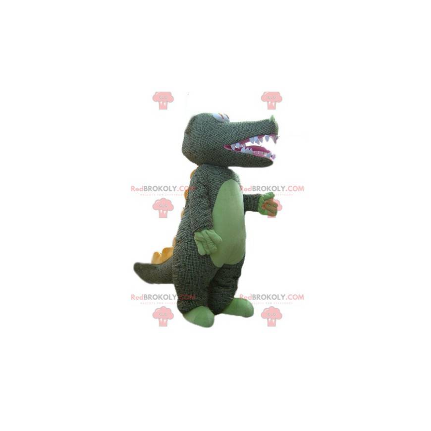 Mascota de cocodrilo verde con escamas de grises -
