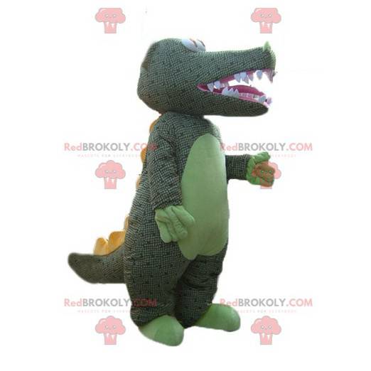 Mascota de cocodrilo verde con escamas de grises -