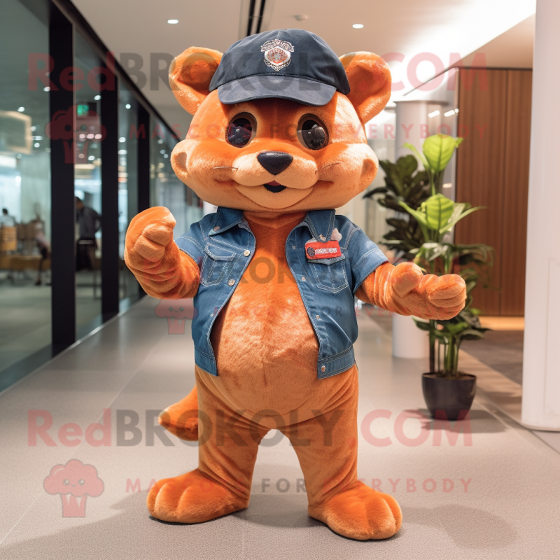Peach Jaguarundi mascot costume character dressed with a Flare Jeans and Berets Peach Jaguarundi mascot costume character dressed with a Flare Jeans and Berets