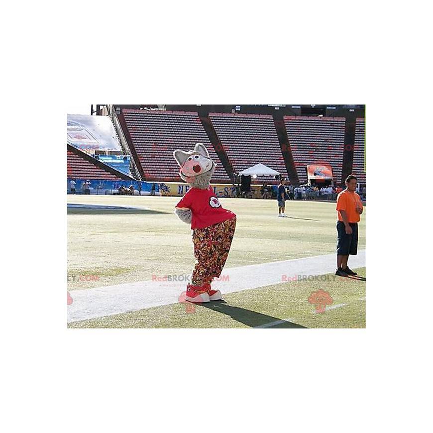 Gray wolf mascot with floral pants and a red t-shirt -