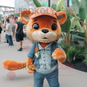 Peach Jaguarundi mascot costume character dressed with a Flare Jeans and Berets