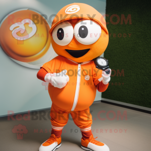 Orange Baseball Ball mascot costume character dressed with a Windbreaker and Smartwatches