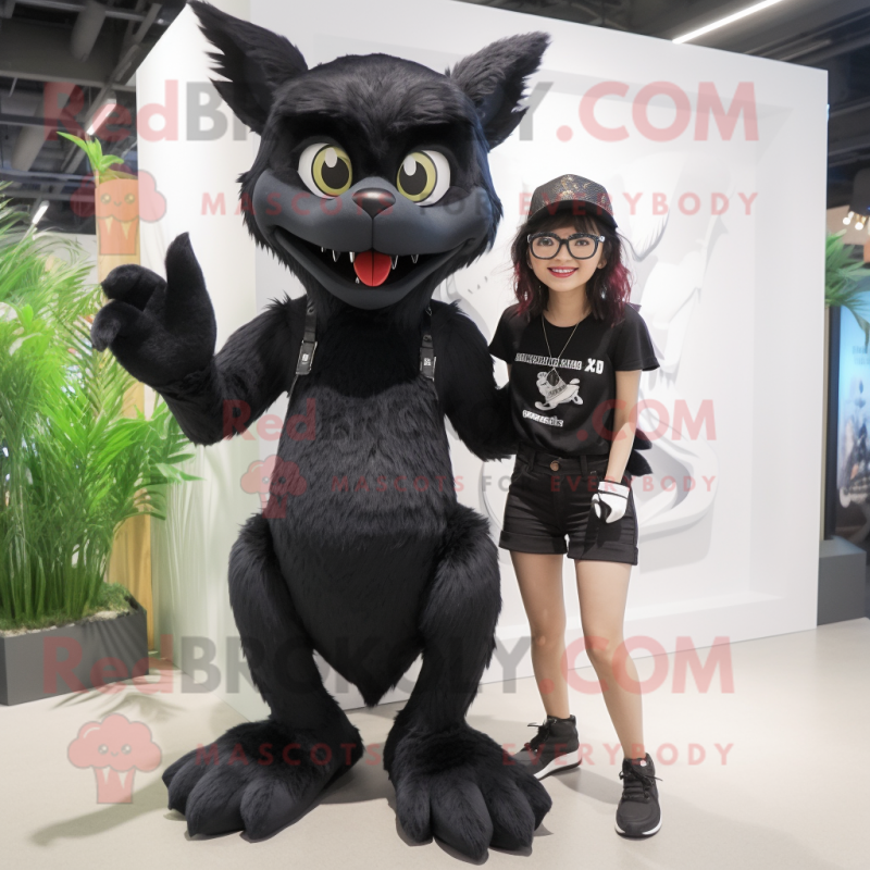 Black Chupacabra mascot costume character dressed with a Mini Skirt and Eyeglasses Black Chupacabra mascot costume character dressed with a Mini Skirt and Eyeglasses