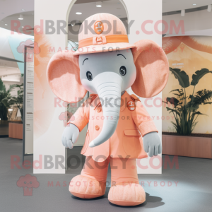 Peach Elephant mascot costume character dressed with a Playsuit and Hats