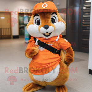 Orange Chipmunk mascot costume character dressed with a Bermuda Shorts and Shawl pins