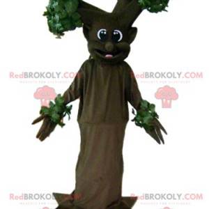 Mascota de árbol marrón y verde gigante y sonriente -