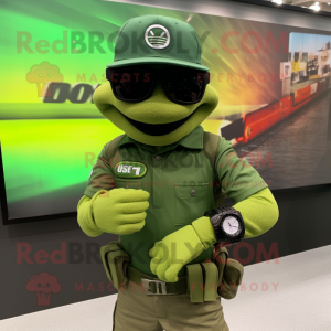 Green Green Beret mascot costume character dressed with a Polo Tee and Smartwatches