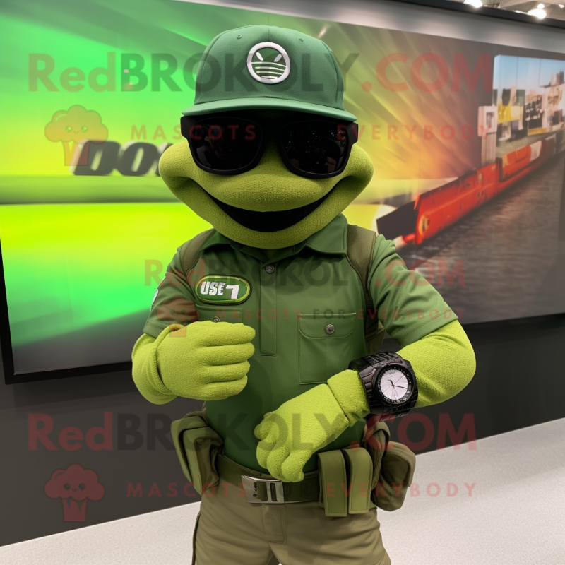 Green Green Beret mascot costume character dressed with a Polo Tee and Smartwatches Green Green Beret mascot costume character dressed with a Polo Tee and Smartwatches
