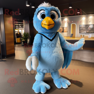 Sky Blue Hawk mascot costume character dressed with a Joggers and Shawl pins