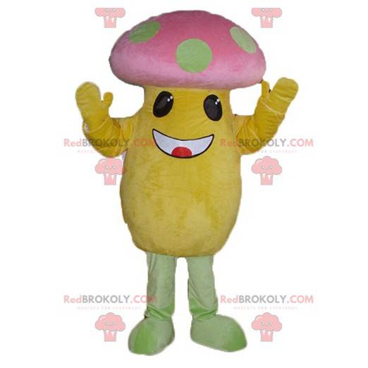 Mascote grande cogumelo amarelo e rosa com pontos verdes -