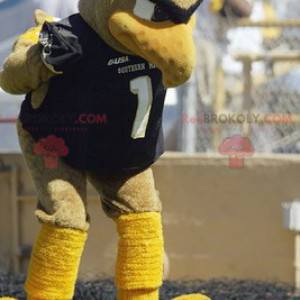 Mascot gran pájaro beige y amarillo en ropa deportiva -
