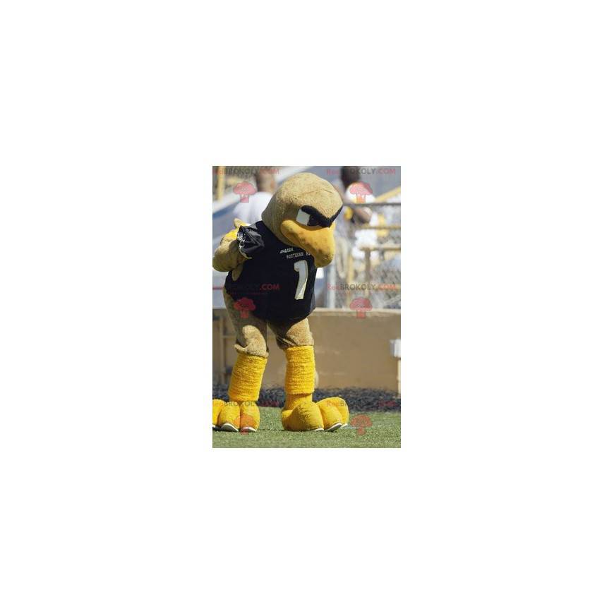 Mascot gran pájaro beige y amarillo en ropa deportiva -