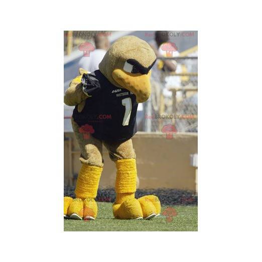 Mascote grande pássaro bege e amarelo em roupas esportivas -