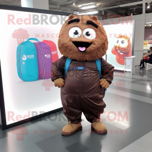 Brown Cupcake mascot costume character dressed with a Windbreaker and Backpacks