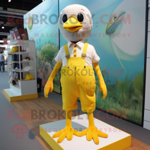 Lemon Yellow Gull mascot costume character dressed with a Overalls and Anklets