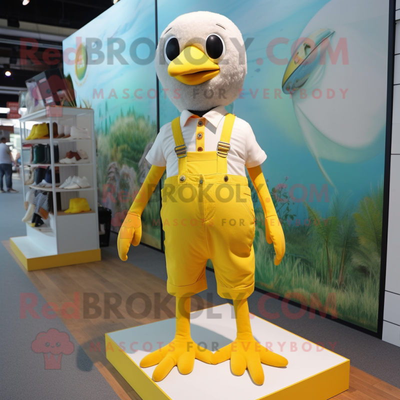 Lemon Yellow Gull mascot costume character dressed with a Overalls and Anklets Lemon Yellow Gull mascot costume character dressed with a Overalls and Anklets