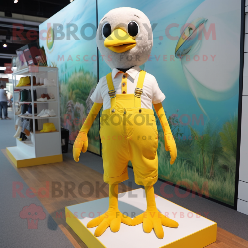 Lemon Yellow Gull mascot costume character dressed with a Overalls and Anklets