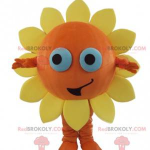 Mascotte de fleur orange et jaune de soleil très souriant -