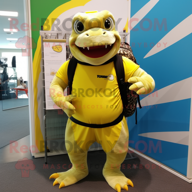 Lemon Yellow Komodo Dragon mascot costume character dressed with a Board Shorts and Backpacks