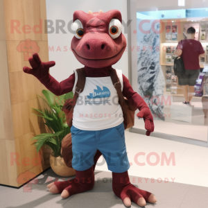 Maroon Lizard mascot costume character dressed with a Denim Shorts and Tote bags