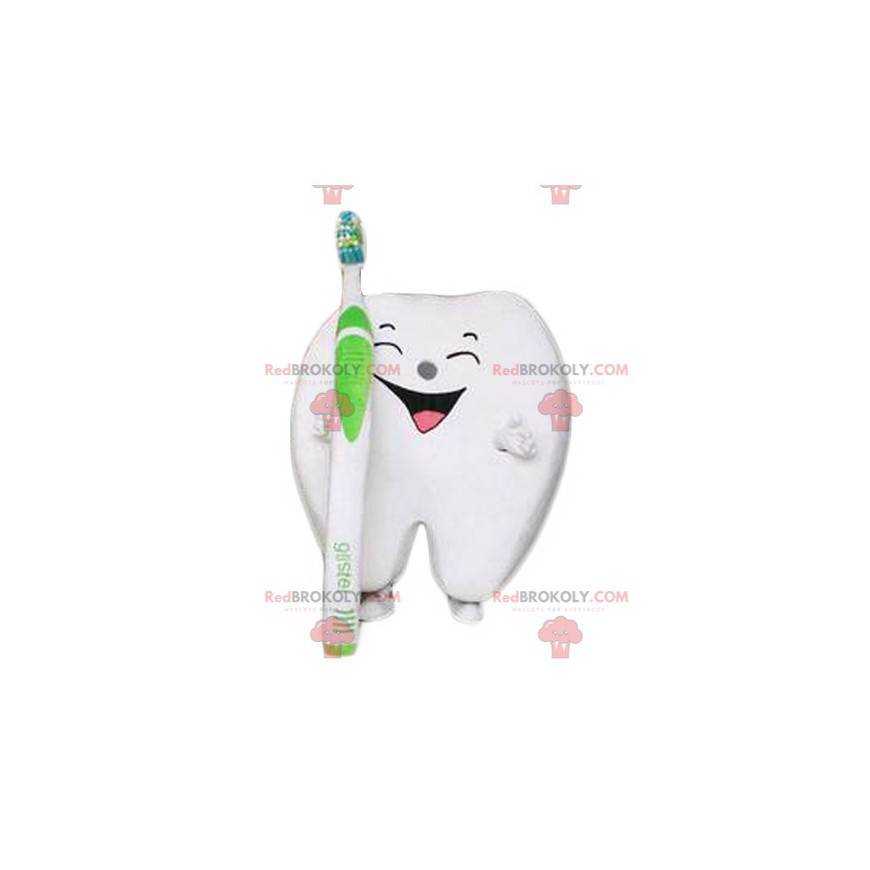 Mascote gigante e sorridente com uma escova de dentes -