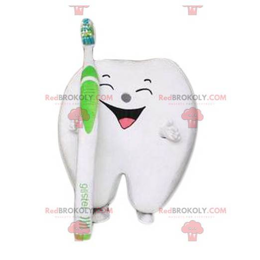 Reusachtige lachende witte tand mascotte met een tandenborstel