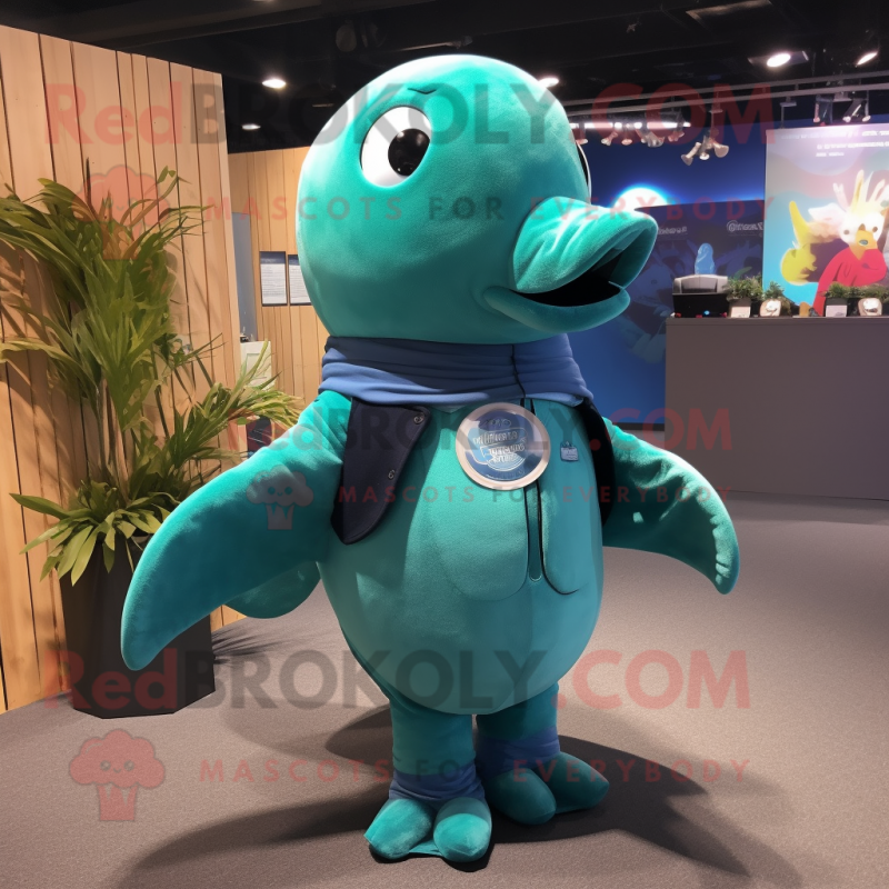 Teal Humpback Whale mascot costume character dressed with a Vest and Rings Teal Humpback Whale mascot costume character dressed with a Vest and Rings