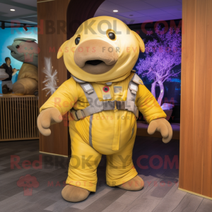 Gold Stellar'S Sea Cow mascot costume character dressed with a Dungarees and Backpacks