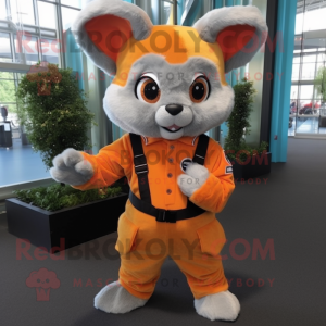 Orange Chinchilla mascot costume character dressed with a Overalls and Rings