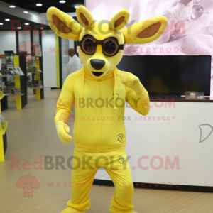 Lemon Yellow Roe Deer mascot costume character dressed with a Joggers and Eyeglasses