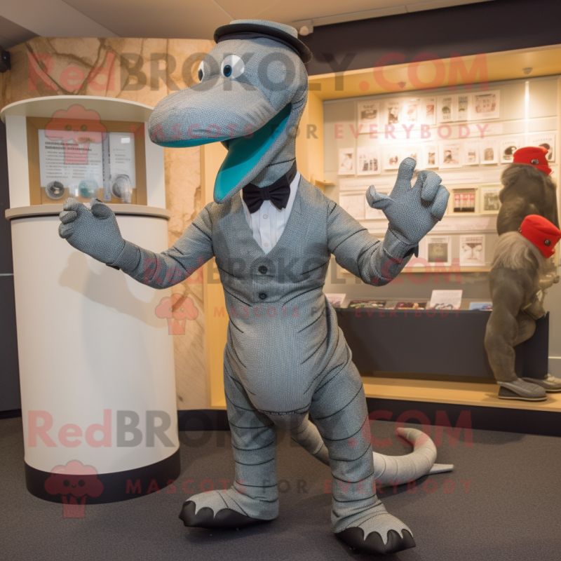 Silver Loch Ness Monster mascot costume character dressed with a Suit and Cummerbunds