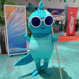 Turquoise Narwhal mascot costume character dressed with a Swimwear and Eyeglasses