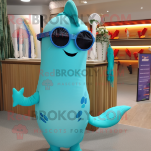 Turquoise Narwhal mascot costume character dressed with a Swimwear and Eyeglasses