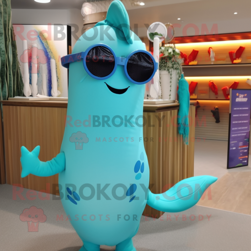 Turquoise Narwhal mascot costume character dressed with a Swimwear and Eyeglasses