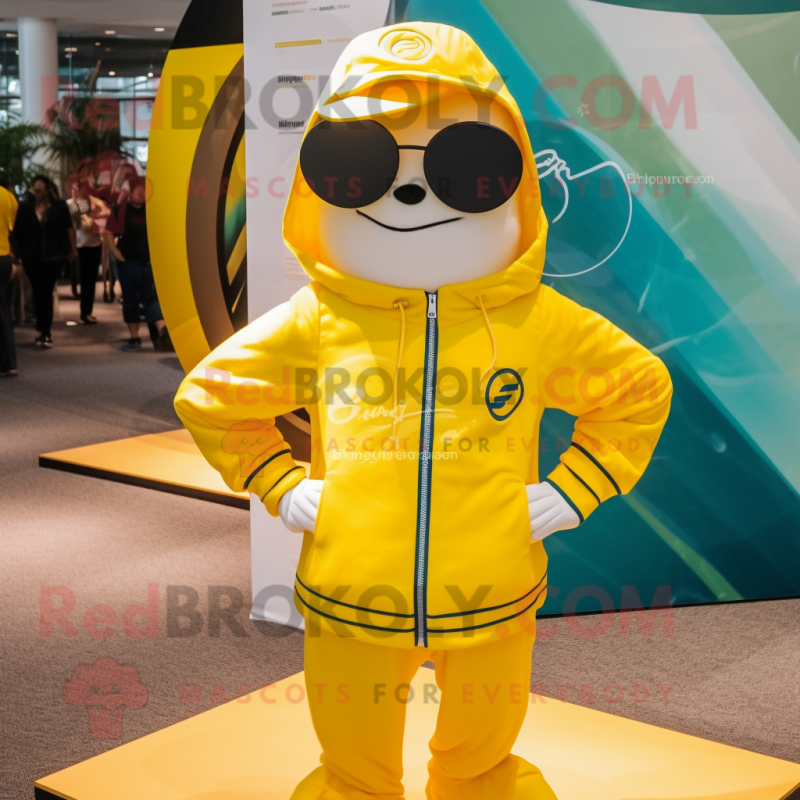 Yellow Plate Spinner mascot costume character dressed with a Windbreaker and Sunglasses