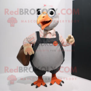 Peach Guinea Fowl mascot costume character dressed with a Overalls and Clutch bags