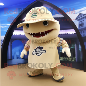 Beige Stingray mascot costume character dressed with a Rugby Shirt and Hat pins