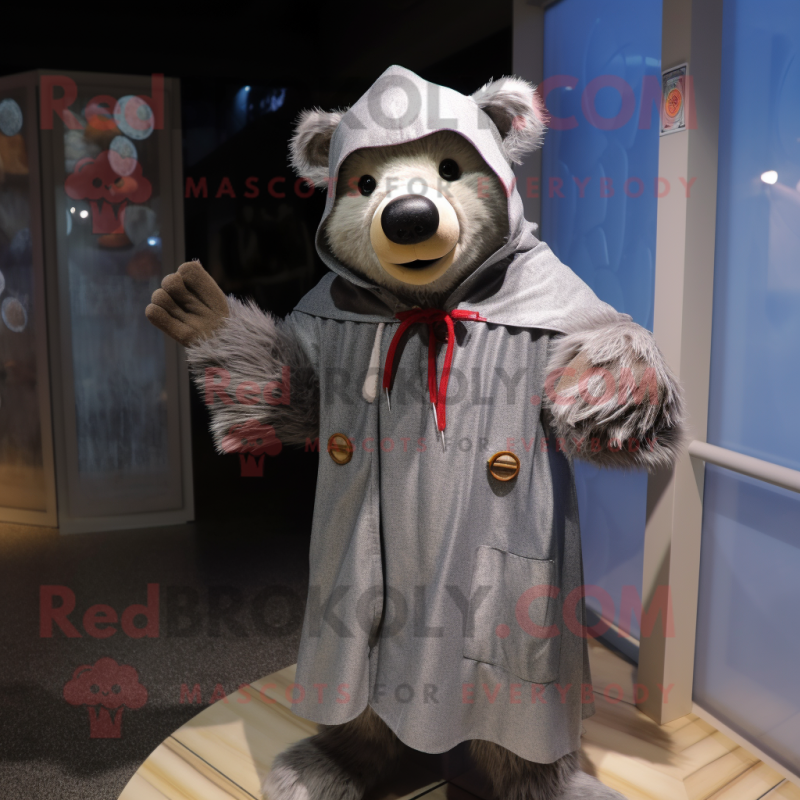 Gray Bear mascot costume character dressed with a Raincoat and Shawl pins Gray Bear mascot costume character dressed with a Raincoat and Shawl pins