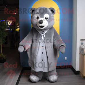 Gray Bear mascot costume character dressed with a Raincoat and Shawl pins