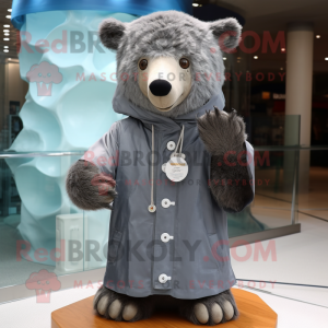 Gray Bear mascot costume character dressed with a Raincoat and Shawl pins