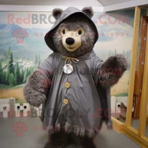 Gray Bear mascot costume character dressed with a Raincoat and Shawl pins
