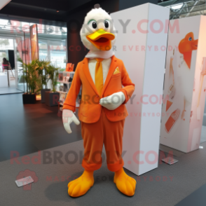 Orange Muscovy Duck mascot costume character dressed with a Suit Pants and Scarves
