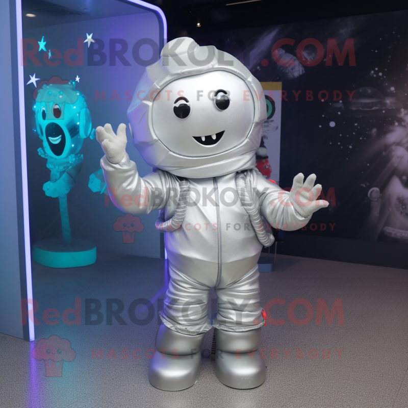 Silver Astronaut mascot costume character dressed with a Parka and Hair clips Silver Astronaut mascot costume character dressed with a Parka and Hair clips