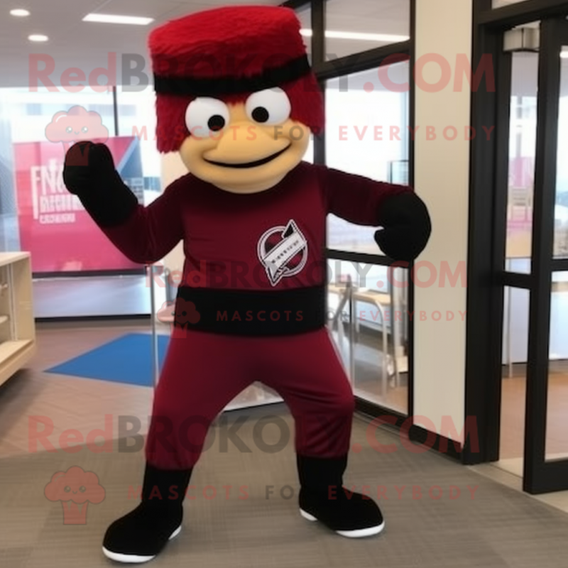 Maroon Knife Thrower mascot costume character dressed with a Joggers and Gloves Maroon Knife Thrower mascot costume character dressed with a Joggers and Gloves
