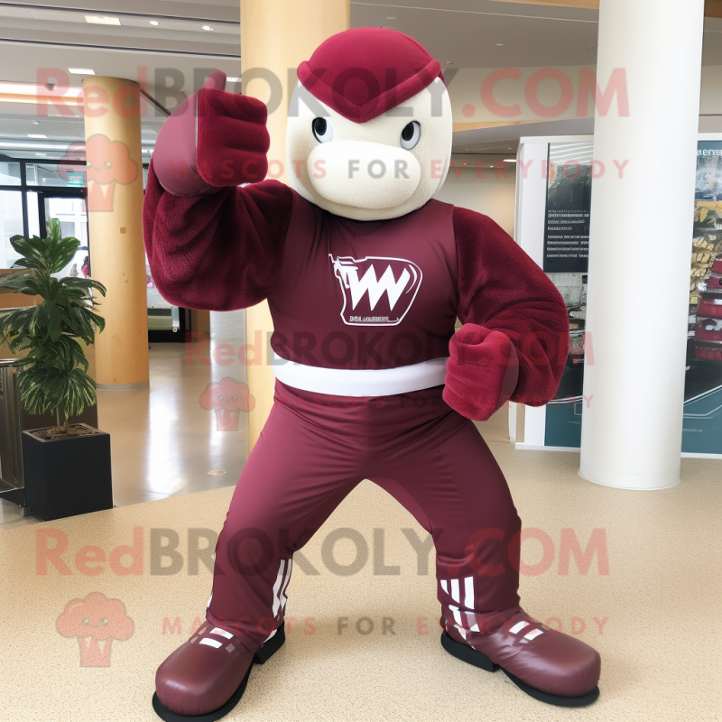 Maroon Knife Thrower mascot costume character dressed with a Joggers and Gloves Maroon Knife Thrower mascot costume character dressed with a Joggers and Gloves